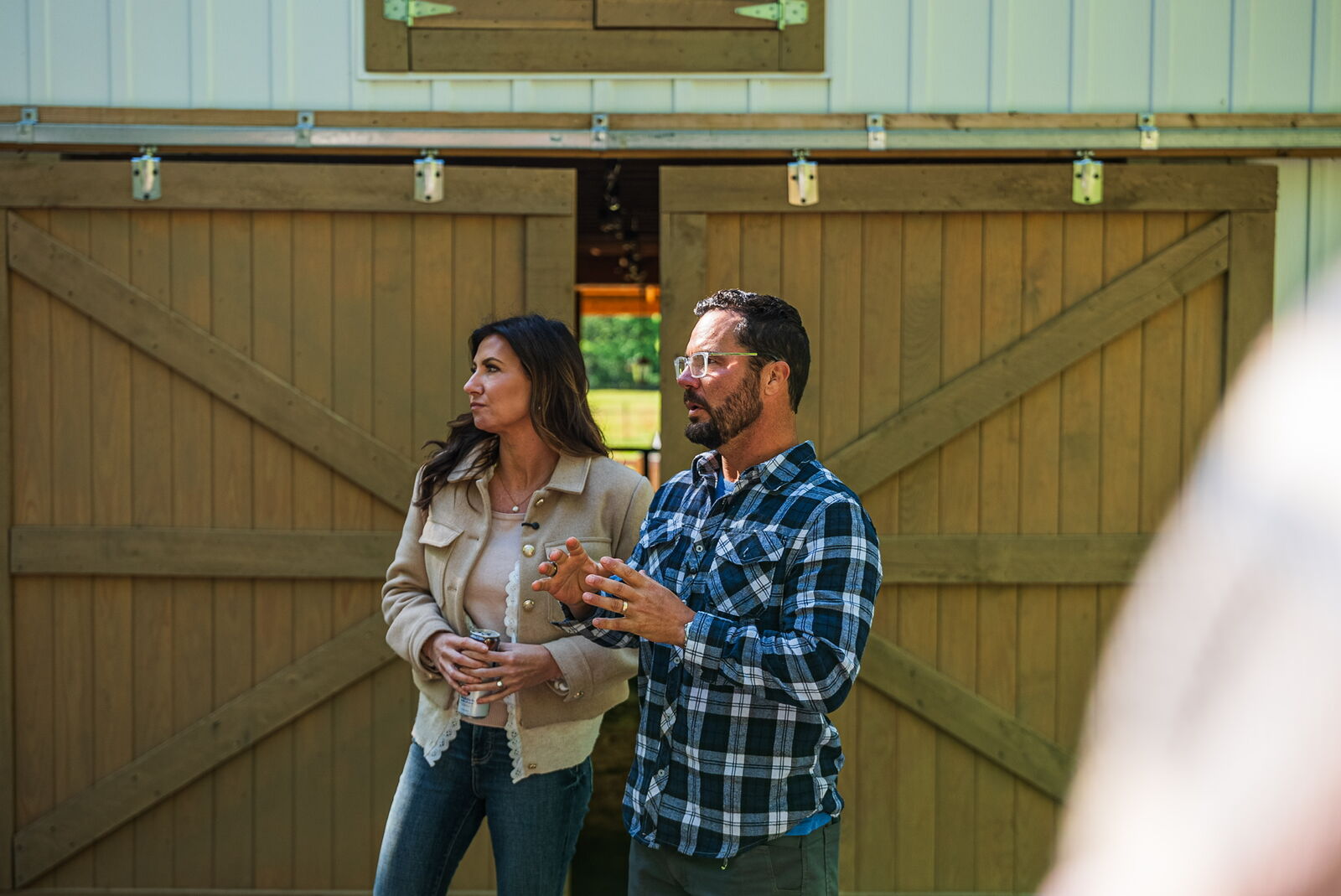 Hosts in front of the barn doors